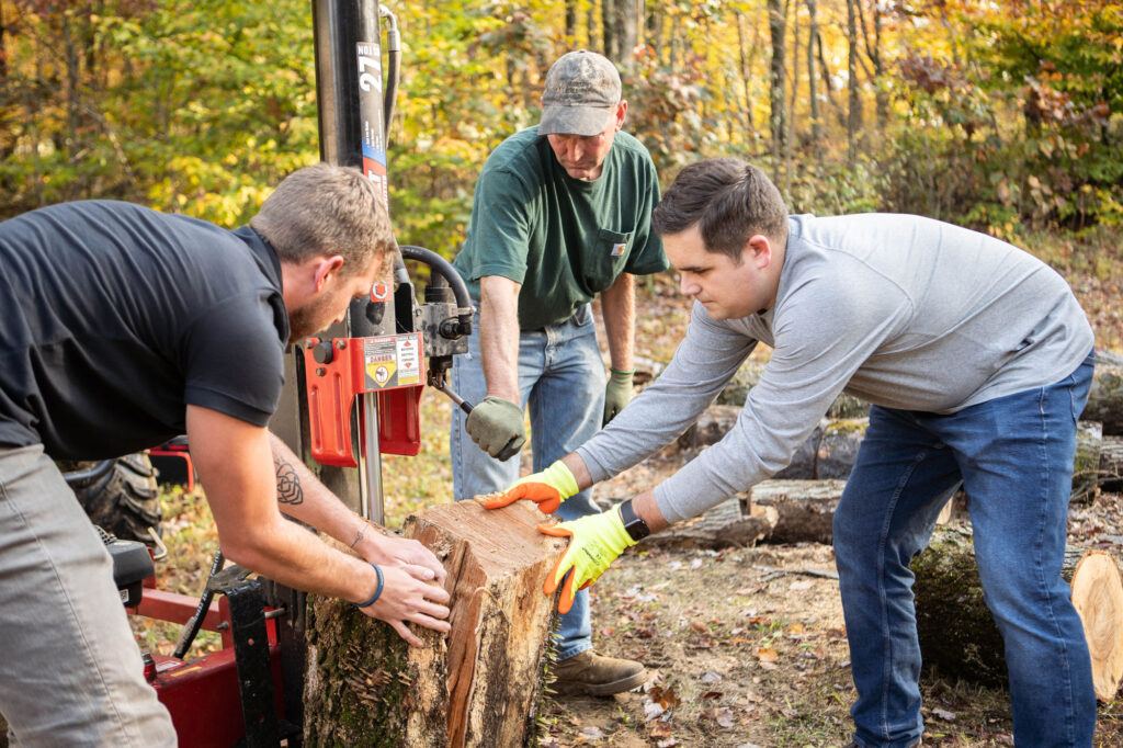 AOS group cutting a tree